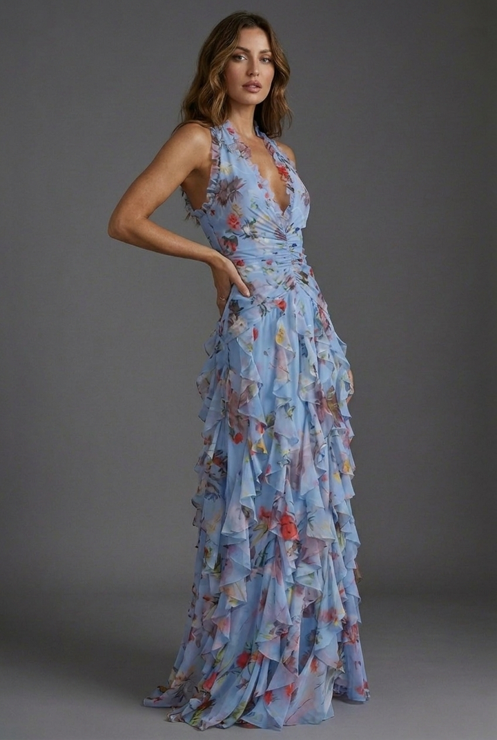 Stunning women's floral halterneck maxi dress with elegant ruffle skirt, a beautiful wedding guest outfit.