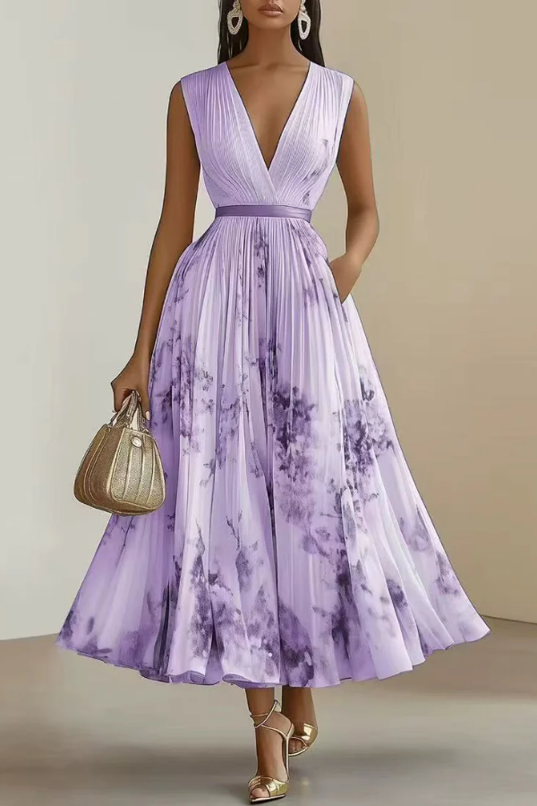 Women's elegant long sleeve floral maxi dress. Features a V-neck and adjustable waist for a flowy fit.