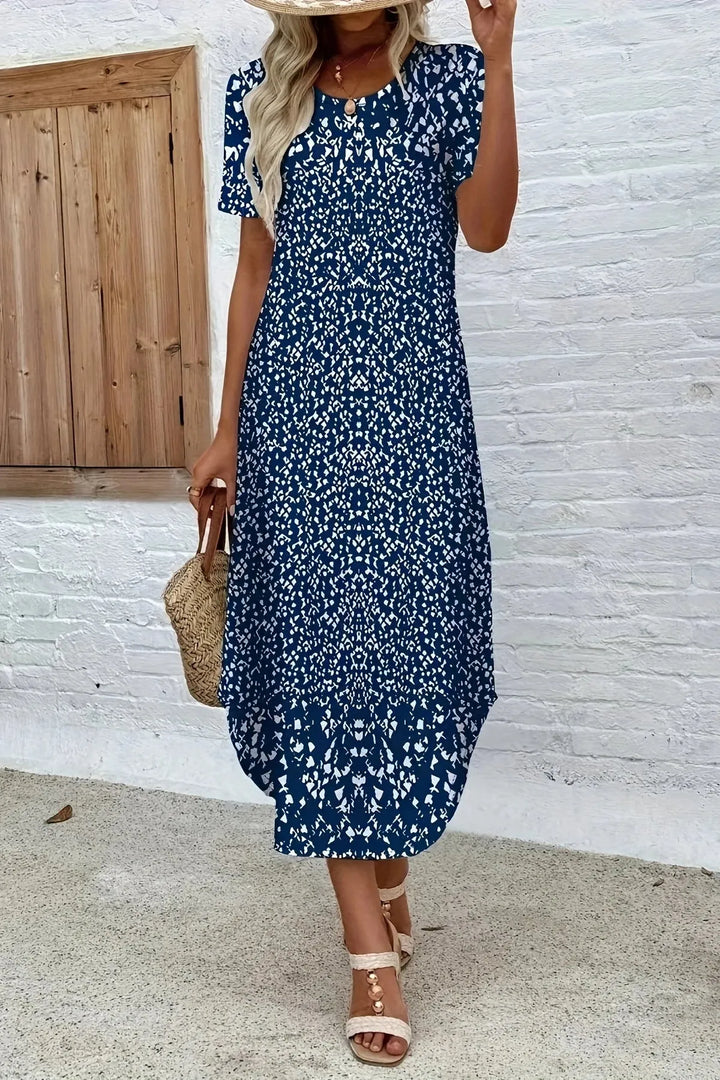 Vibrant floral print maxi gown for women, an elegant summer dress perfect for beach or party. Comfortable flowy fit.