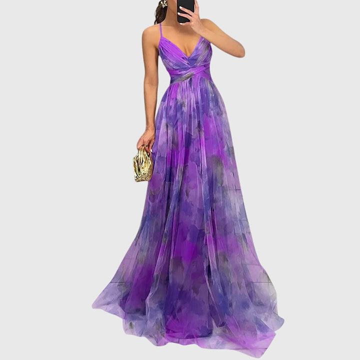 Women's elegant floral print maxi dress with adjustable straps, a versatile summer and beach outfit.