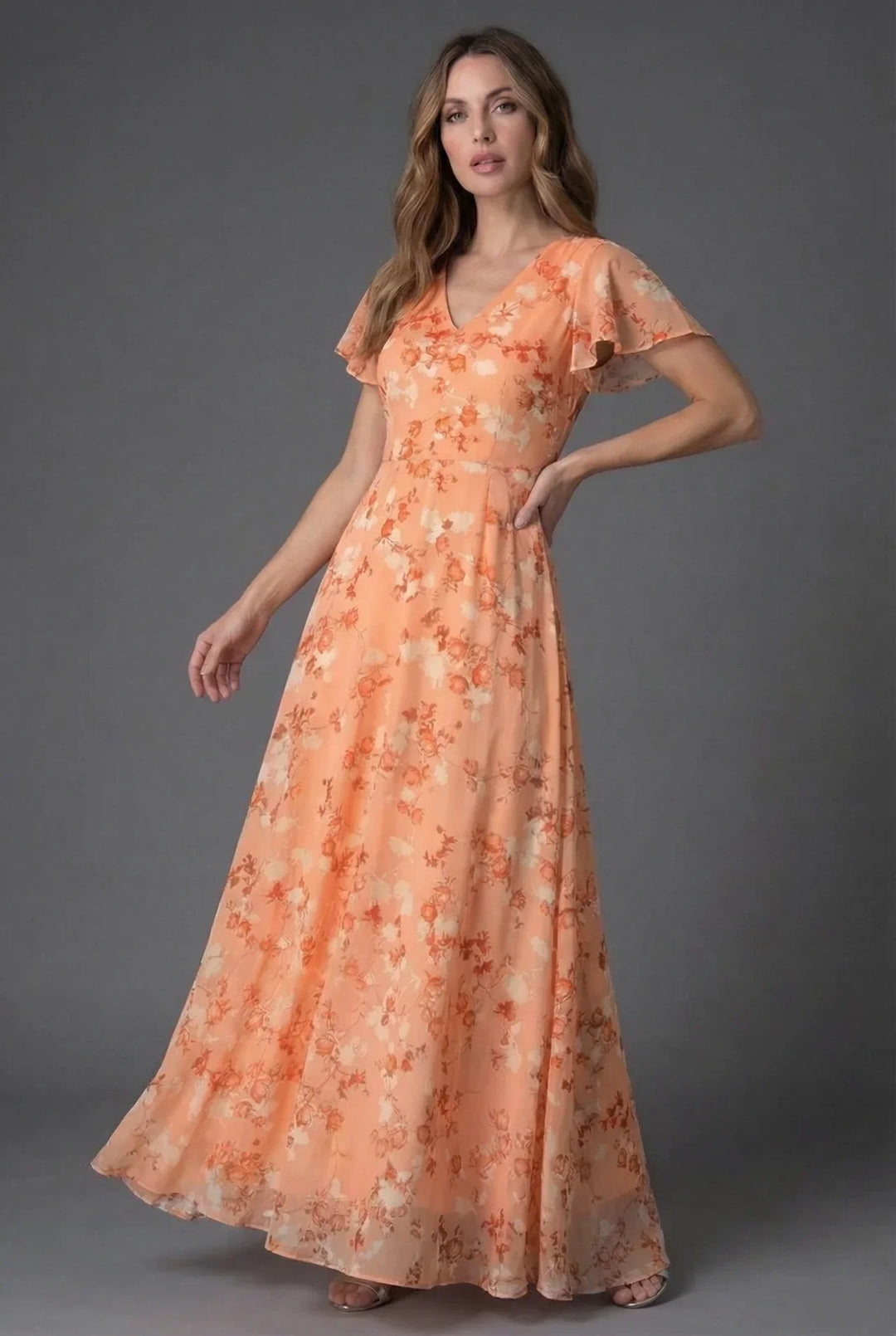 Stylish women's long floral dress with a flattering V-neckline & delicate flutter sleeves. Great for special occasions.