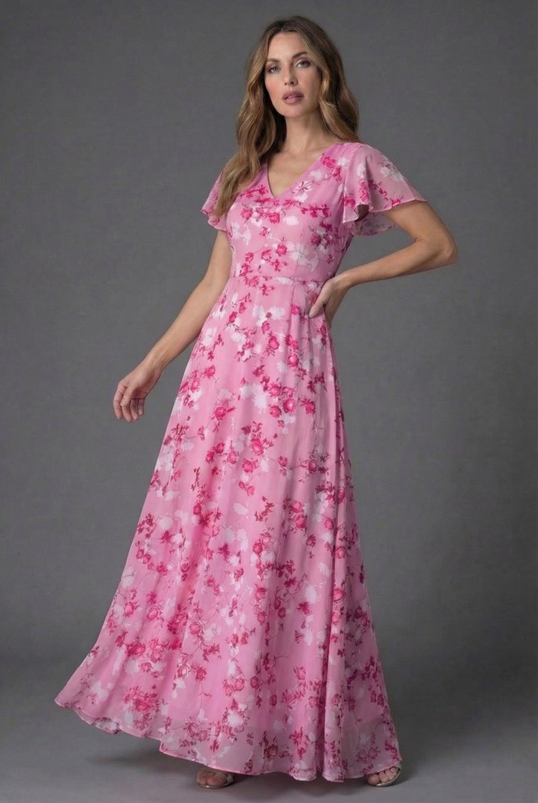 Long floral maxi dress for women, featuring a chic V-neck & graceful flutter sleeves. Ideal as a wedding guest or party dress.