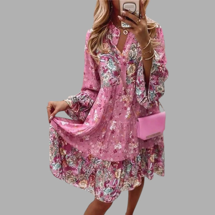 Elegant women's floral midi dress, perfect for spring/summer semi-formal occasions. Flattering printed design.