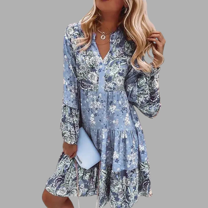 Stylish floral printed midi dress for women, offering comfort & feminine elegance. Ideal for spring/summer fashion.