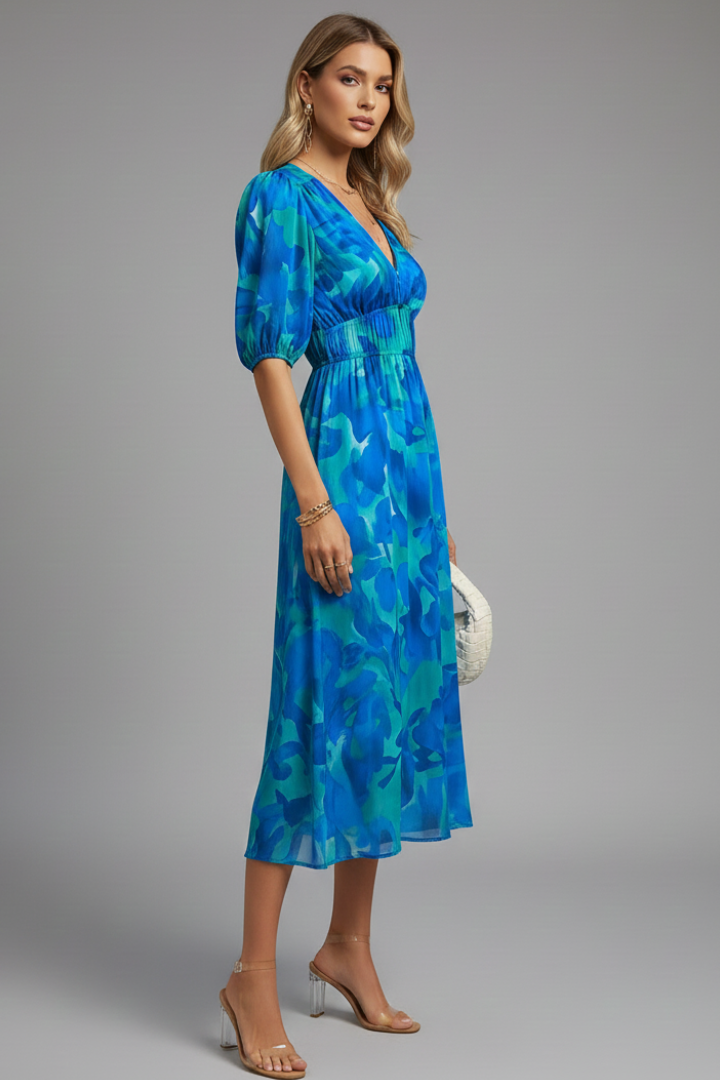 Beautiful women's floral print midi dress featuring elegant puff sleeves, a spring fashion essential.