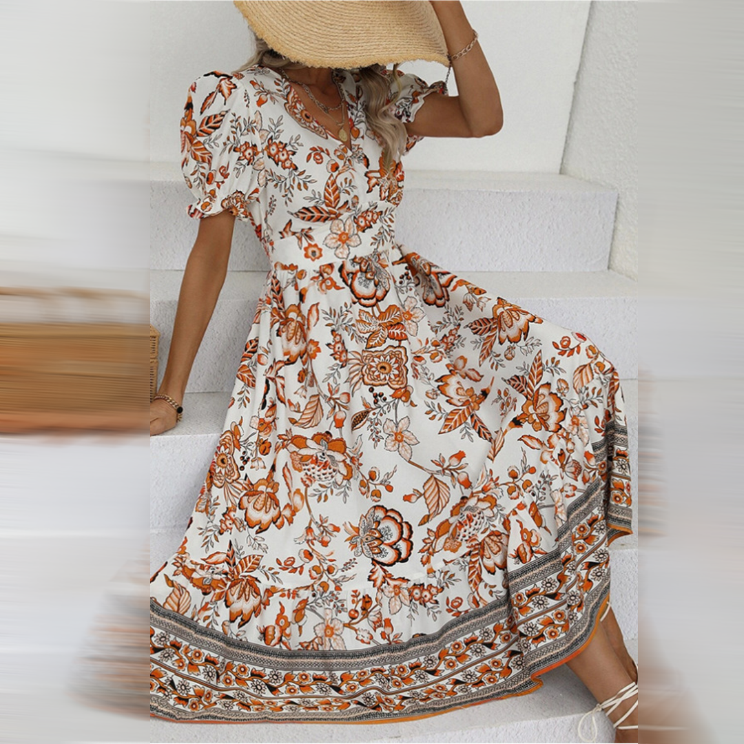 Woman models a vibrant floral midi dress with romantic puff sleeves & flattering V-neck, great for parties & events.