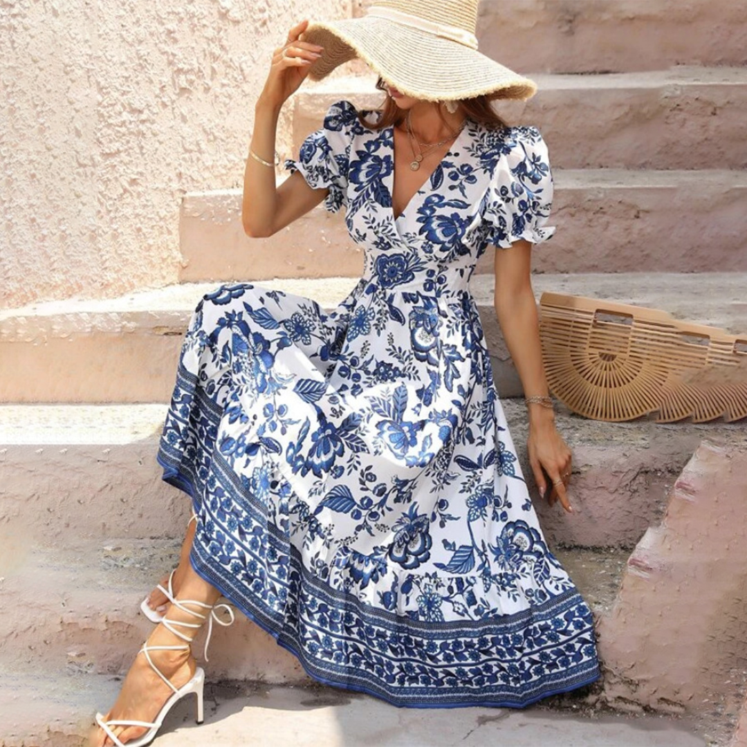 Comfortable & chic floral midi dress for women, featuring puff sleeves & a V-neck, perfect for spring/summer fashion.