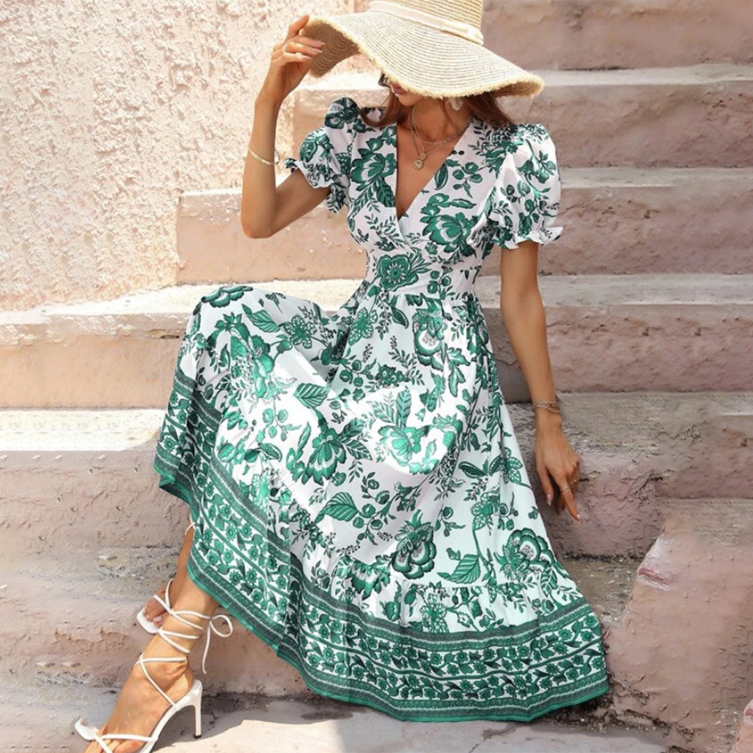 Detail of an elegant women's floral midi dress showcasing romantic puff sleeves, a flattering V-neck, and A-line cut.
