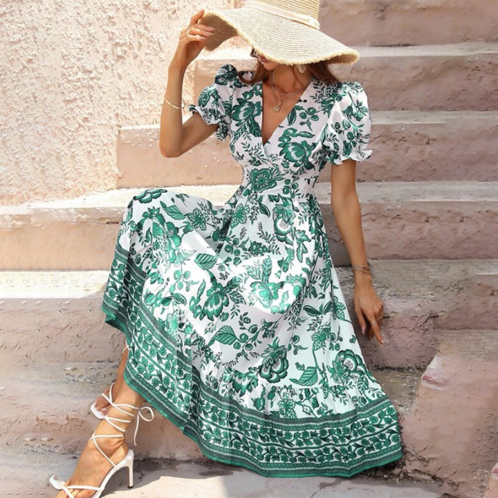 Detail of an elegant women's floral midi dress showcasing romantic puff sleeves, a flattering V-neck, and A-line cut.