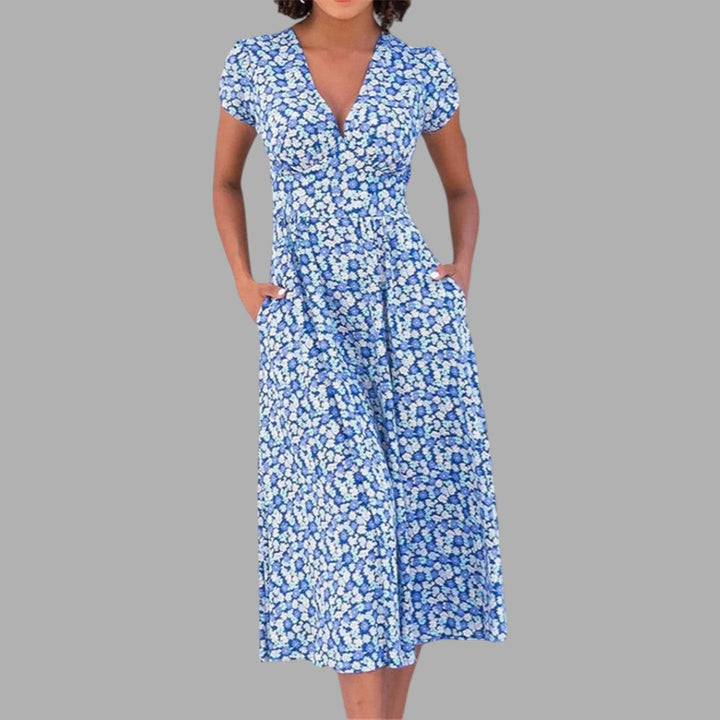 Elegant women's floral midi dress with V-neck and practical pockets, perfect for spring/summer occasions.
