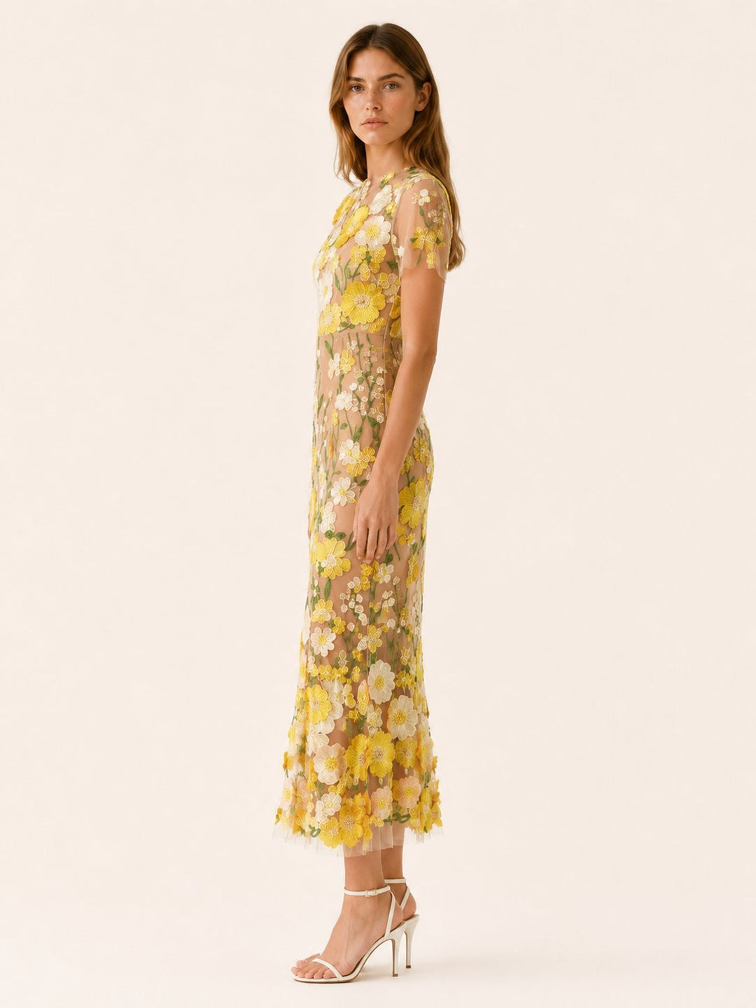 Close-up of vibrant floral pattern on an elegant women's midi occasion dress, perfect for garden parties.