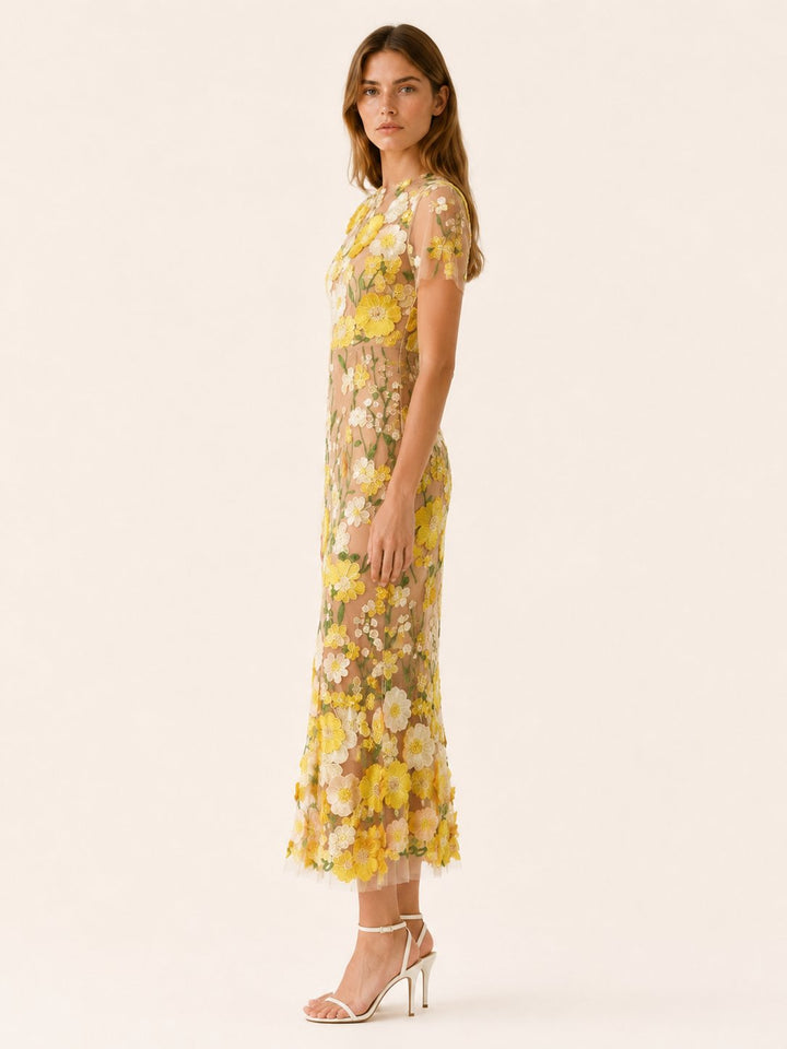 Close-up of vibrant floral pattern on an elegant women's midi occasion dress, perfect for garden parties.