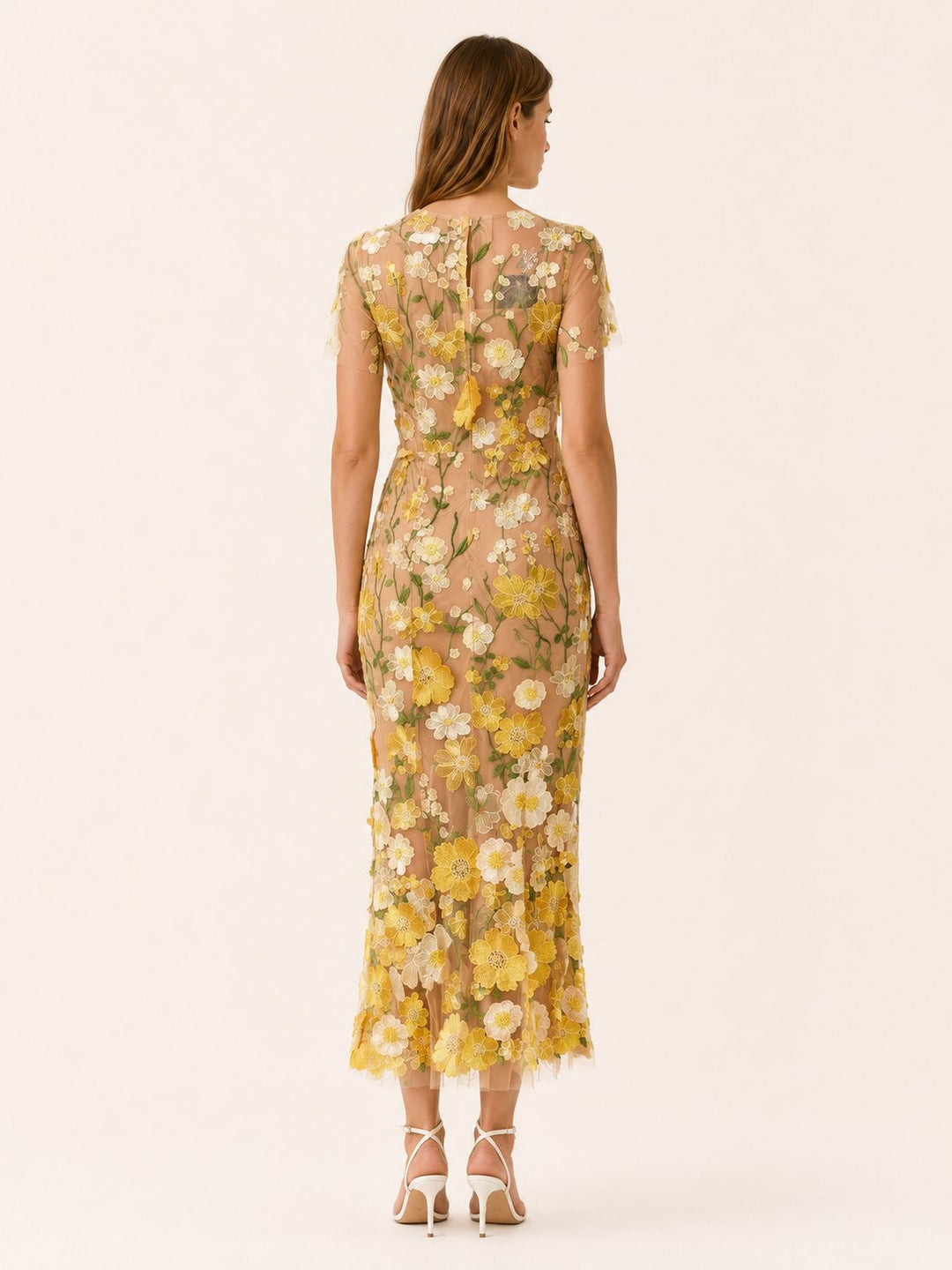 Model wearing a stylish floral midi dress, ideal for a wedding guest, brunch, or formal party event.