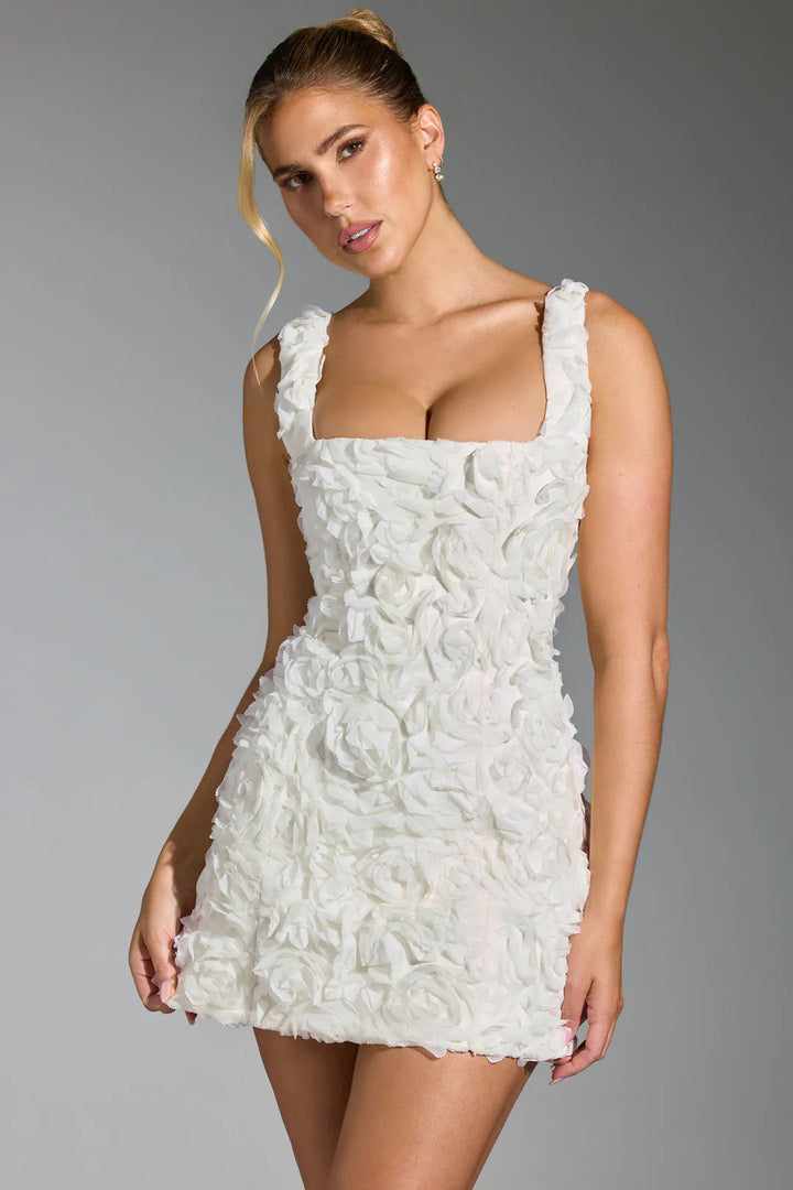 Vibrant floral mini party dress for women. Elegant short sleeve design, perfect for spring/summer occasions.