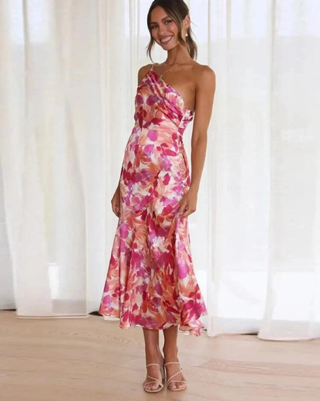 Women's elegant one-shoulder midi dress with beautiful floral design, ideal for wedding guests.