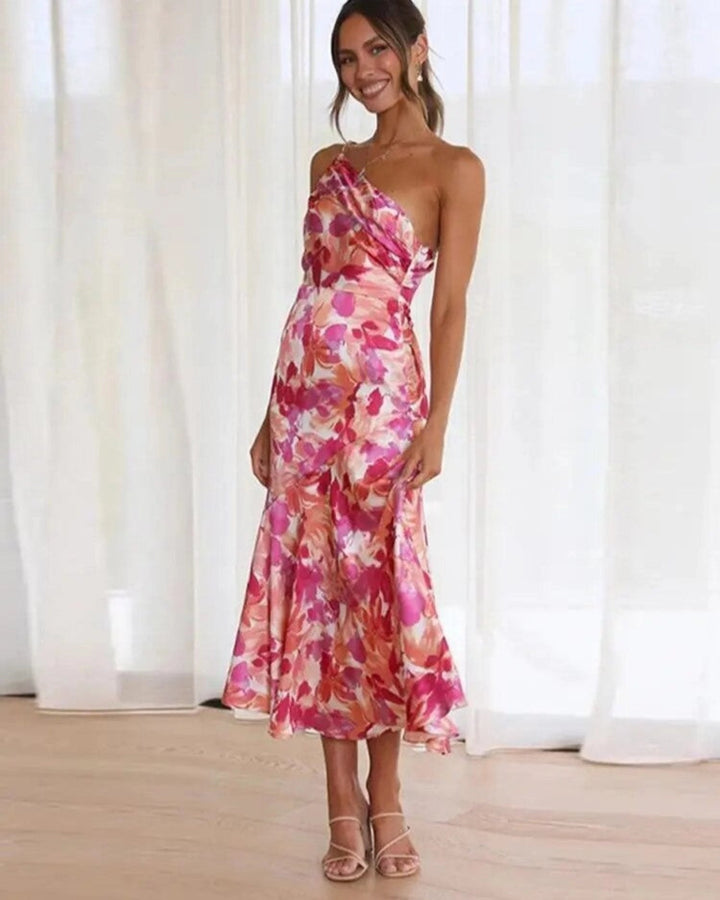 Women's elegant one-shoulder midi dress with beautiful floral design, ideal for wedding guests.