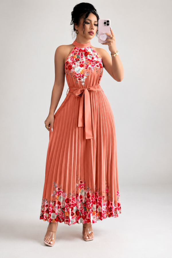 Vibrant floral women's midi dress, elegantly pleated, with a modern square neck silhouette.