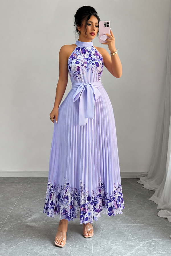 Stylish women's square neck midi dress, adorned with a vibrant floral pattern and delicate pleats.