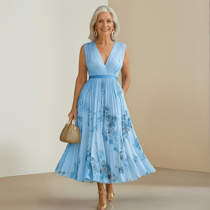 Sleeveless floral midi dress for women, featuring a V-neck and elegant pleats, party-ready.
