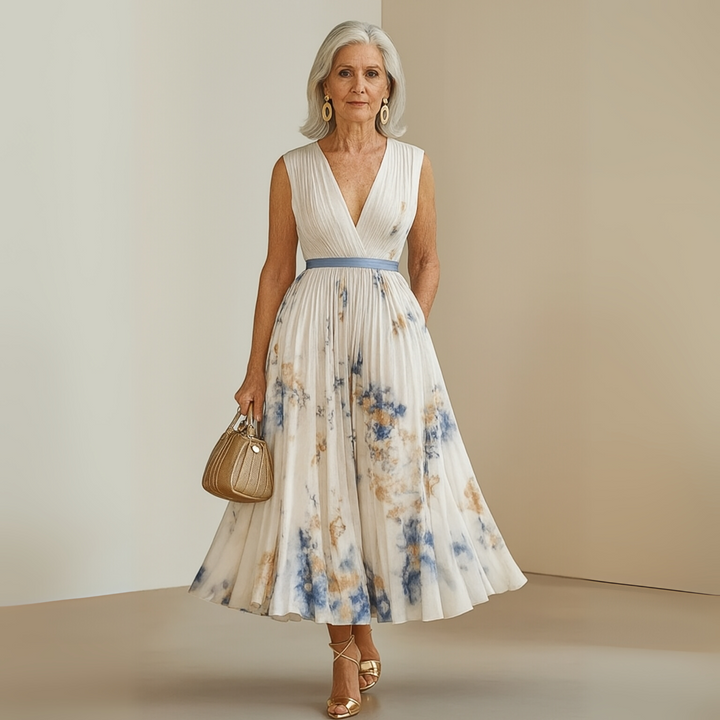 Flowy women's elegant floral V-neck midi dress with stylish pleats, great for summer gatherings.