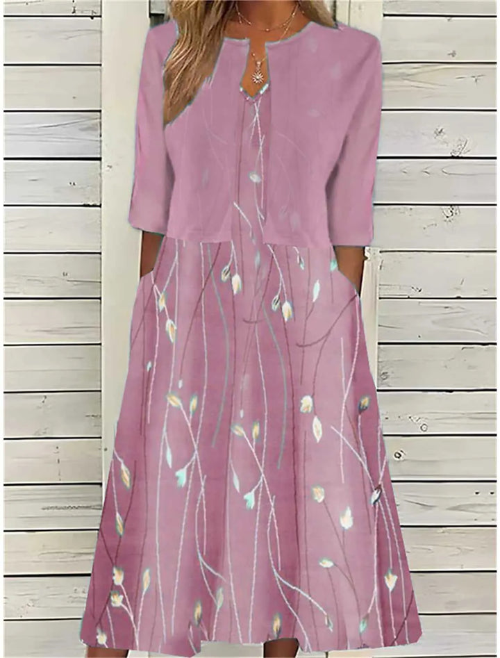Chic women's floral print midi dress featuring practical pockets. Ideal for elegant spring/summer daytime wear.