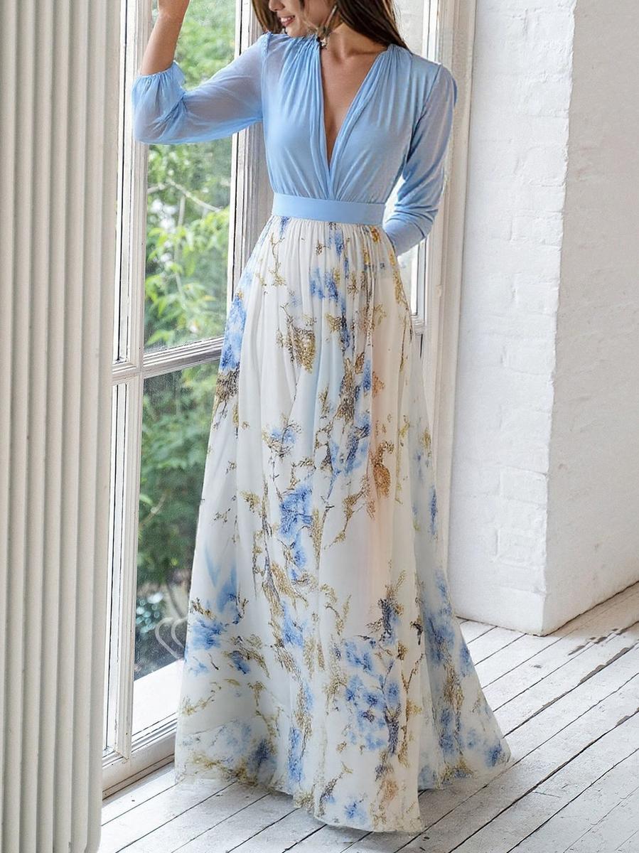 Stylish women's V-neck maxi dress with a vibrant floral print and flowing fabric, great for casual summer wear.