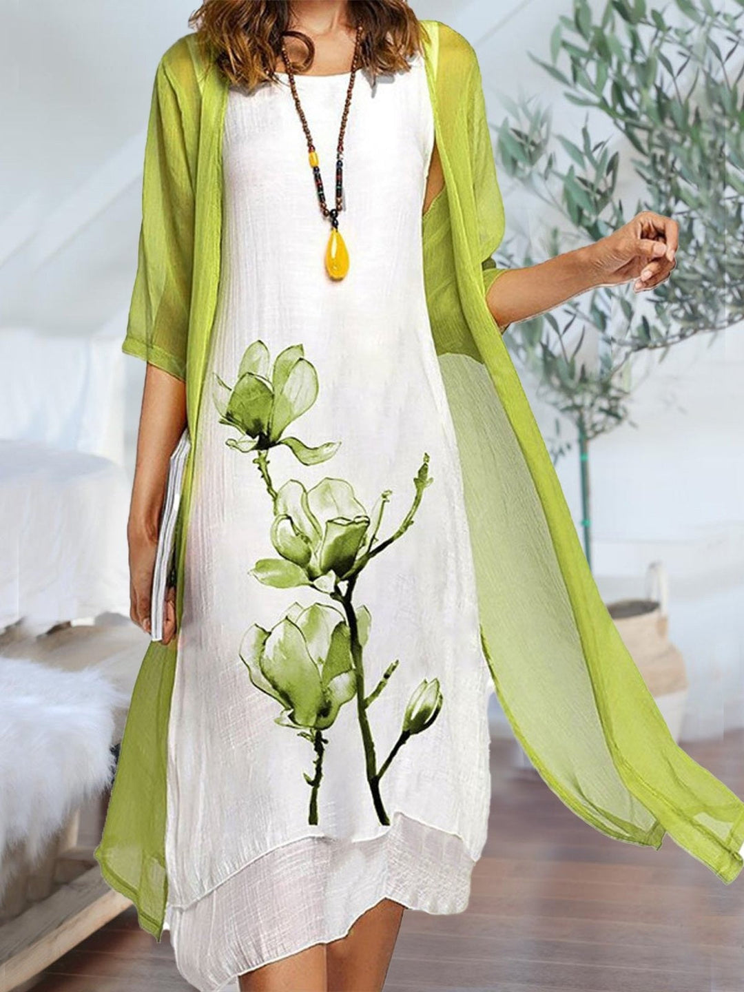 Elegant women's floral print midi dress and sheer cardigan two-piece set, perfect for spring/summer fashion.