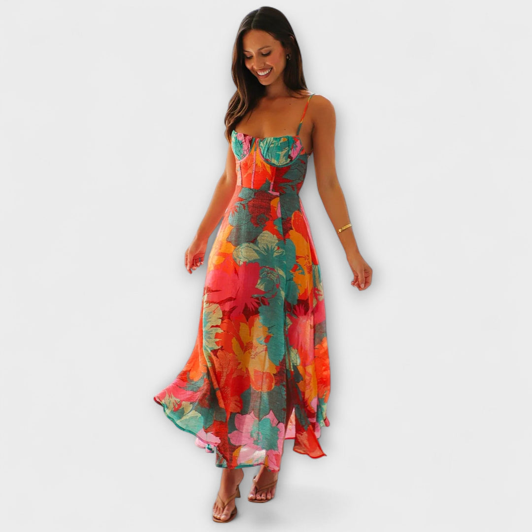 Vibrant floral print cocktail dress for women, ideal for parties & summer gatherings. Elegant midi length with tie-back.