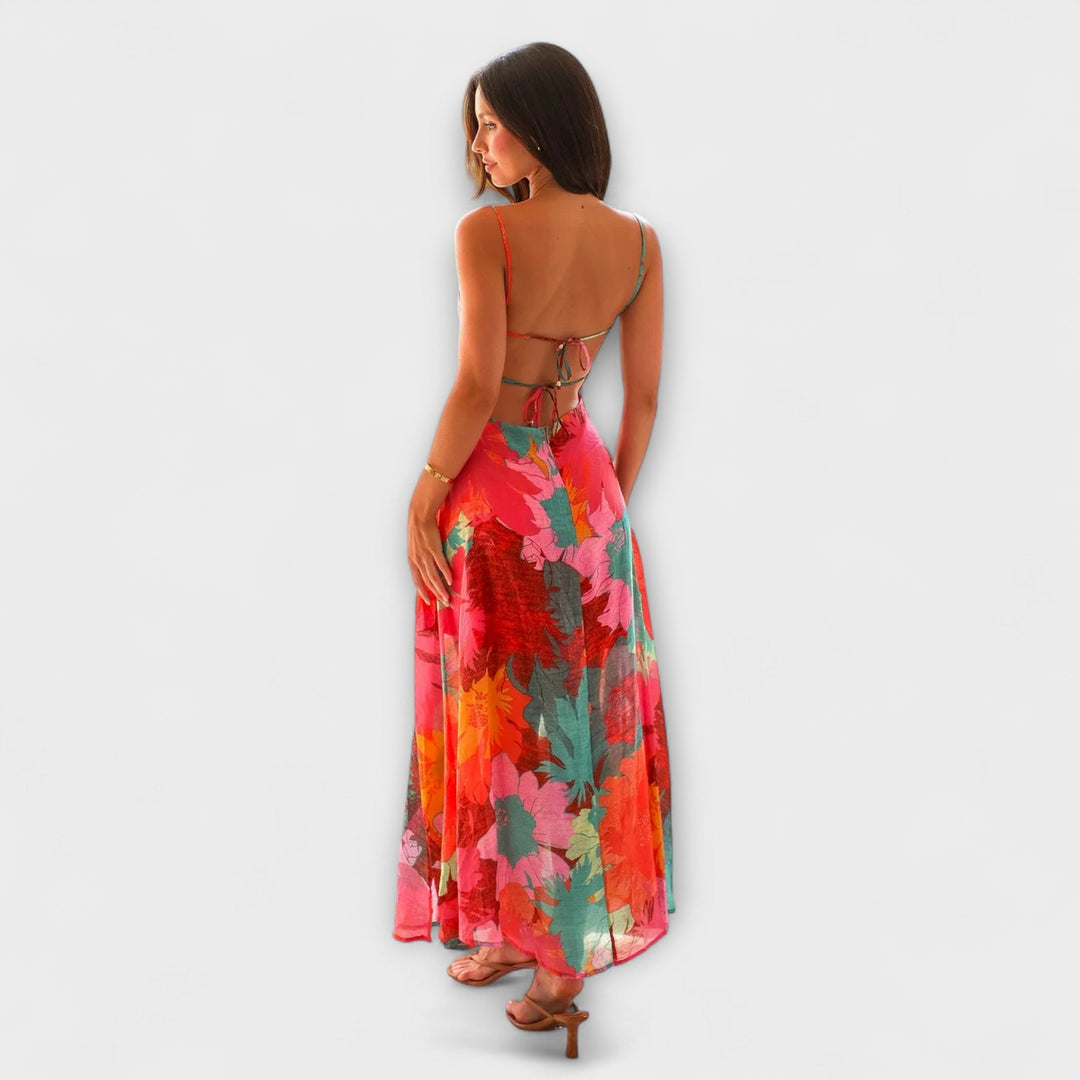 Women's elegant floral print midi dress featuring a trendy tie-back. Versatile for cocktail parties & evening events.