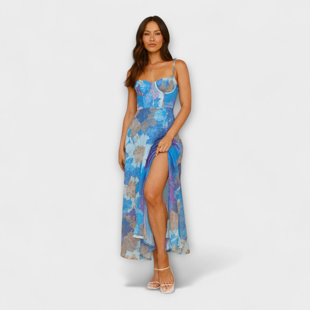 Vivid floral print women's dress for special gatherings & occasions. Elegant midi length with a chic tie-back detail.