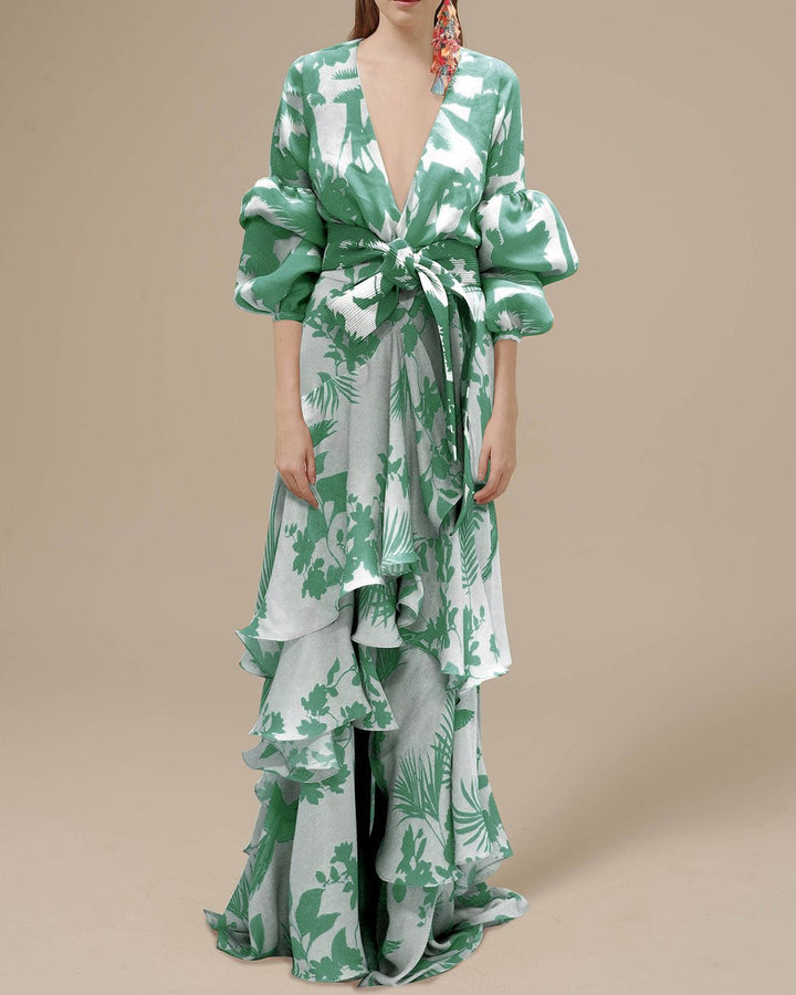 Statement floral maxi dress for women featuring voluminous sleeves & belted waist, ideal for a party or elegant event.