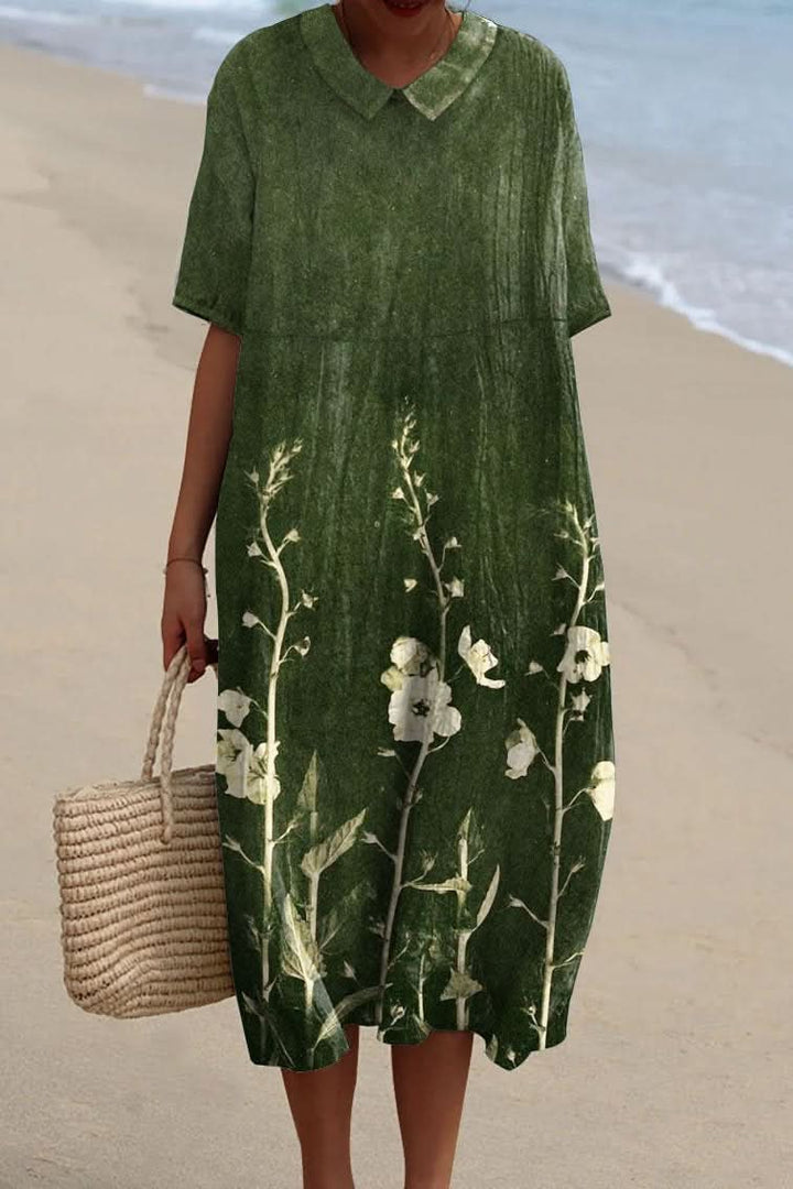 Chic women's floral V-neck midi dress, an essential flowy day dress for summer holidays.