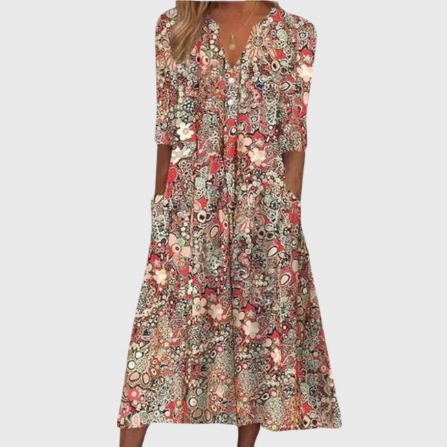 Feminine floral V-neck midi dress for women, A-line cut with half sleeves, ideal for summer vacation wear.