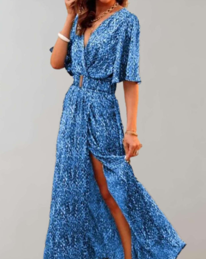 Women's elegant floral wrap maxi dress with a V-neck, flowy silhouette, and high side slit, perfect for resort wear.
