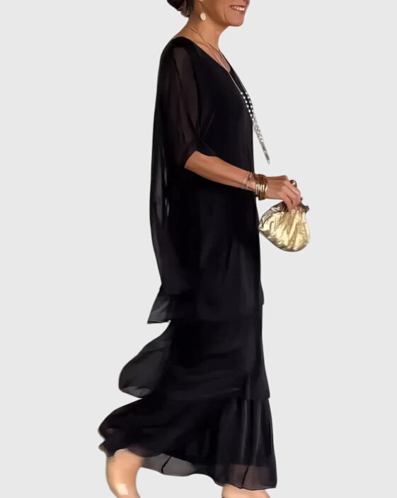 Relaxed fit women's maxi dress, flowing fabric, half-sleeve button-up design for special occasions.