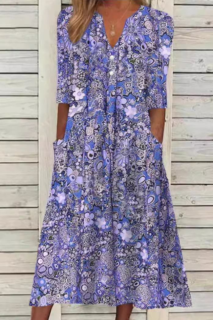 Close-up of a women's elegant patterned midi dress, showcasing its vibrant print & comfortable, flowing fabric.