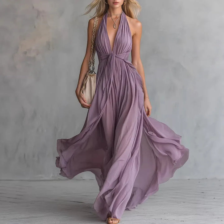 Elegant women's flowy pleated maxi evening dress with backless design and halter neck, perfect for formal events.