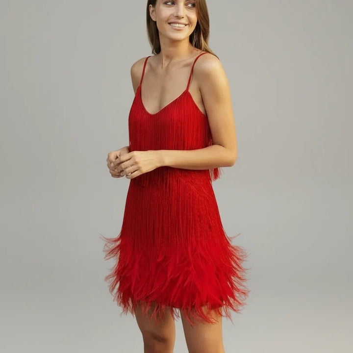Sophisticated women's fringe mini dress with a bodycon fit. Elegant sleeveless design for statement party wear.