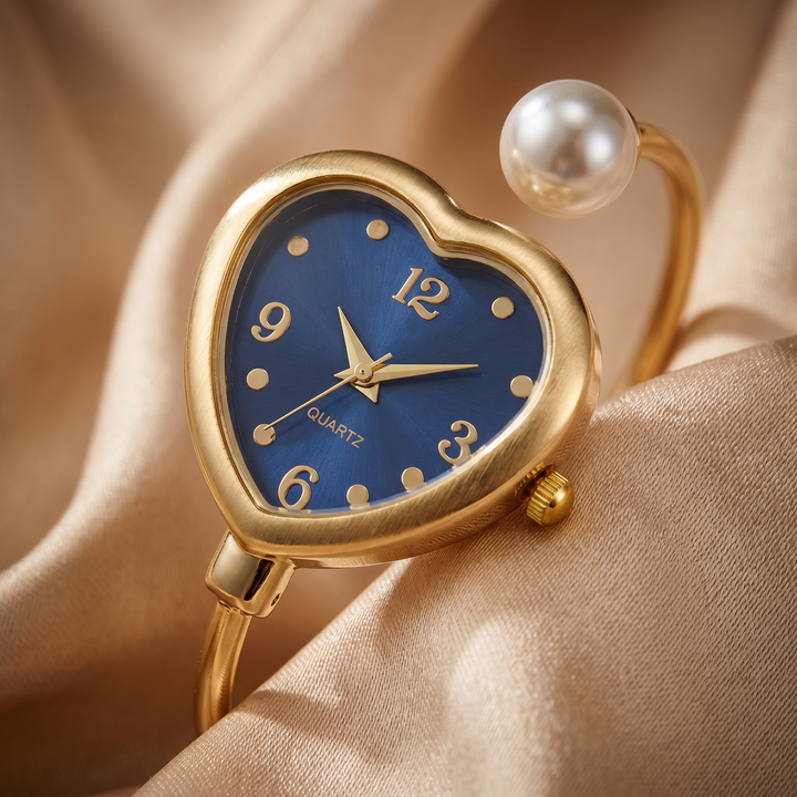 Gold women's elegant quartz watch with a unique heart and pearl accent bracelet. Perfect delicate jewelry watch.