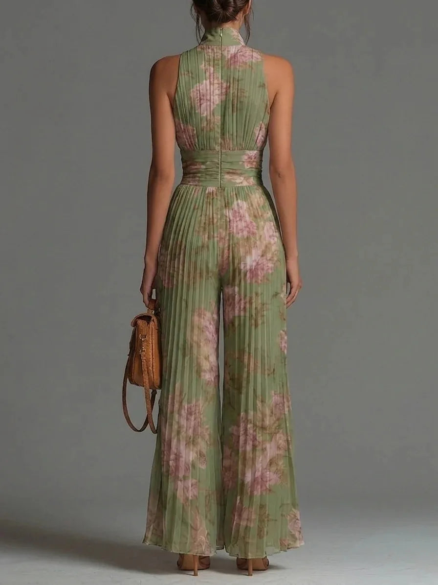 Flowy women's pleated floral print halter jumpsuit with wide legs, ideal for party wear or a vacation outfit.