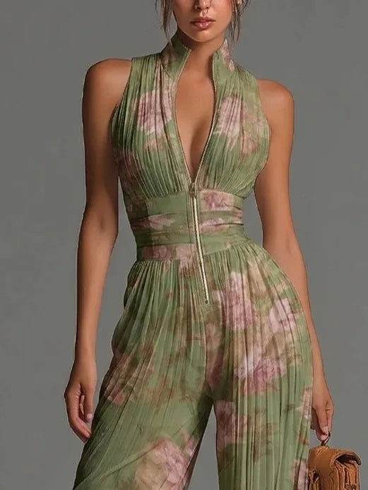 Stylish green & white floral halter jumpsuit for women, featuring pleats & wide legs, comfortable for summer fashion.