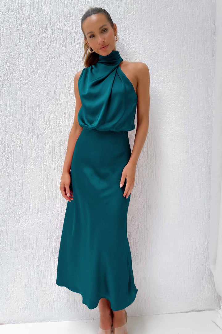 Women's glamorous open back halter dress, floor-length, ideal for black-tie events.