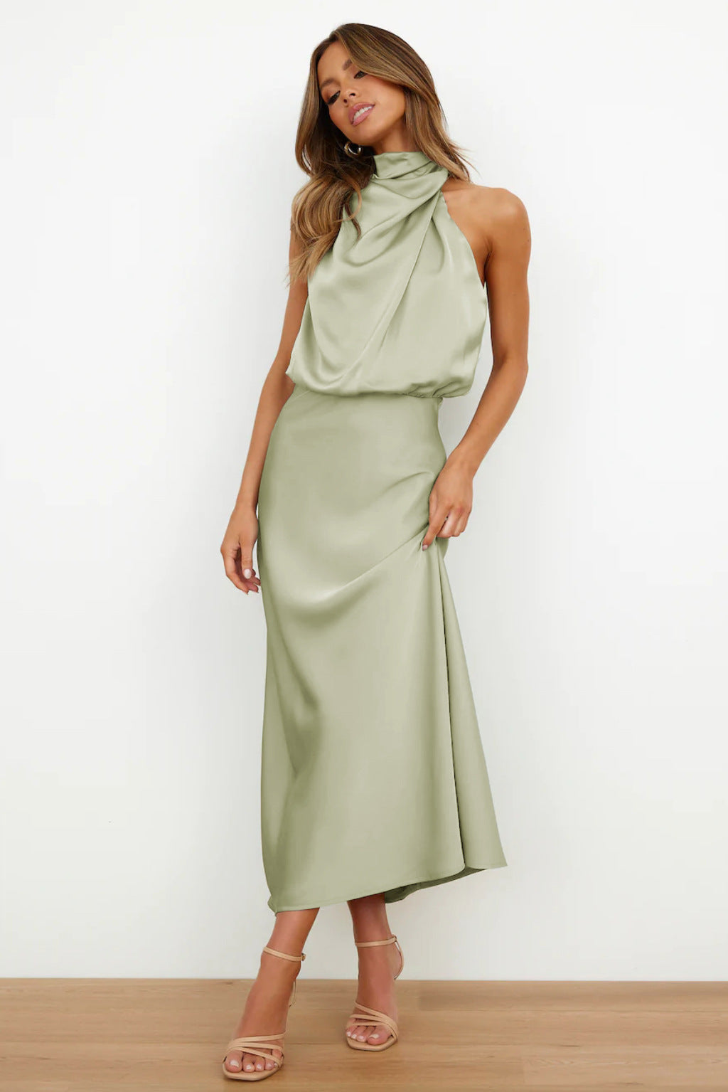Stunning women's formal gown, halter neckline, open back, floor-length silhouette, party ready.