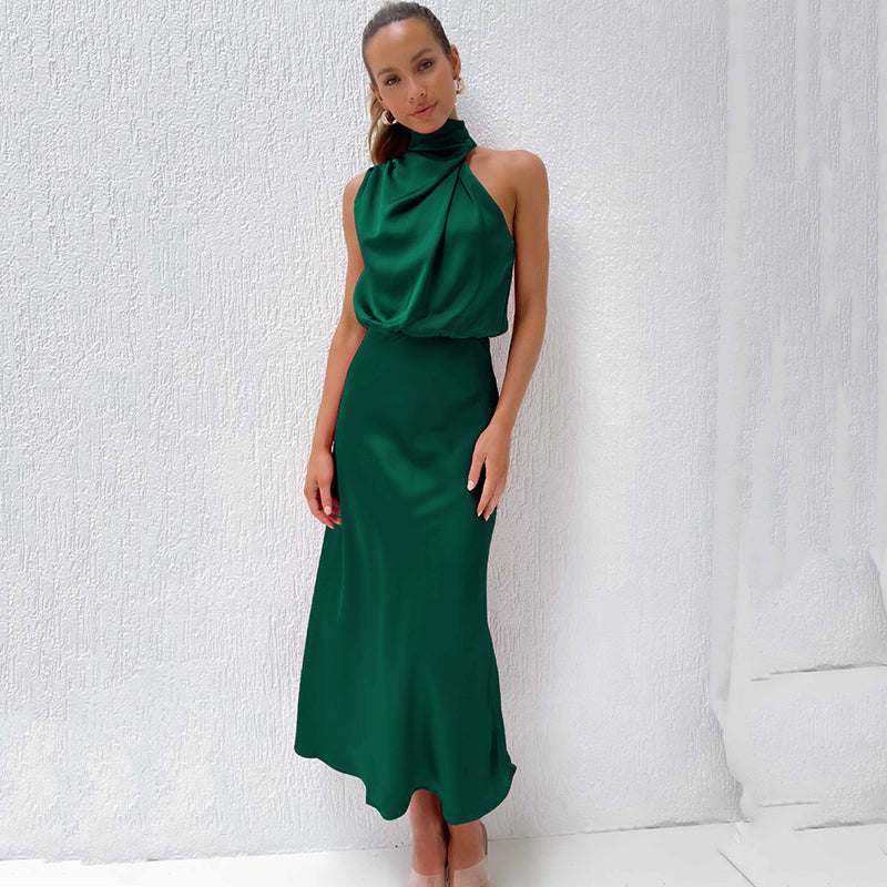 Glamorous women's halter gala dress, open back, flowing floor-length design, perfect for party wear.