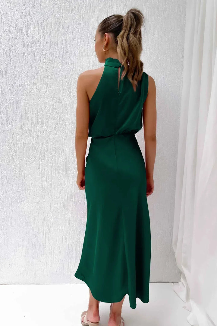 Elegant women's halter evening gown, open back, flowing skirt, ideal long formal dress for wedding guests.