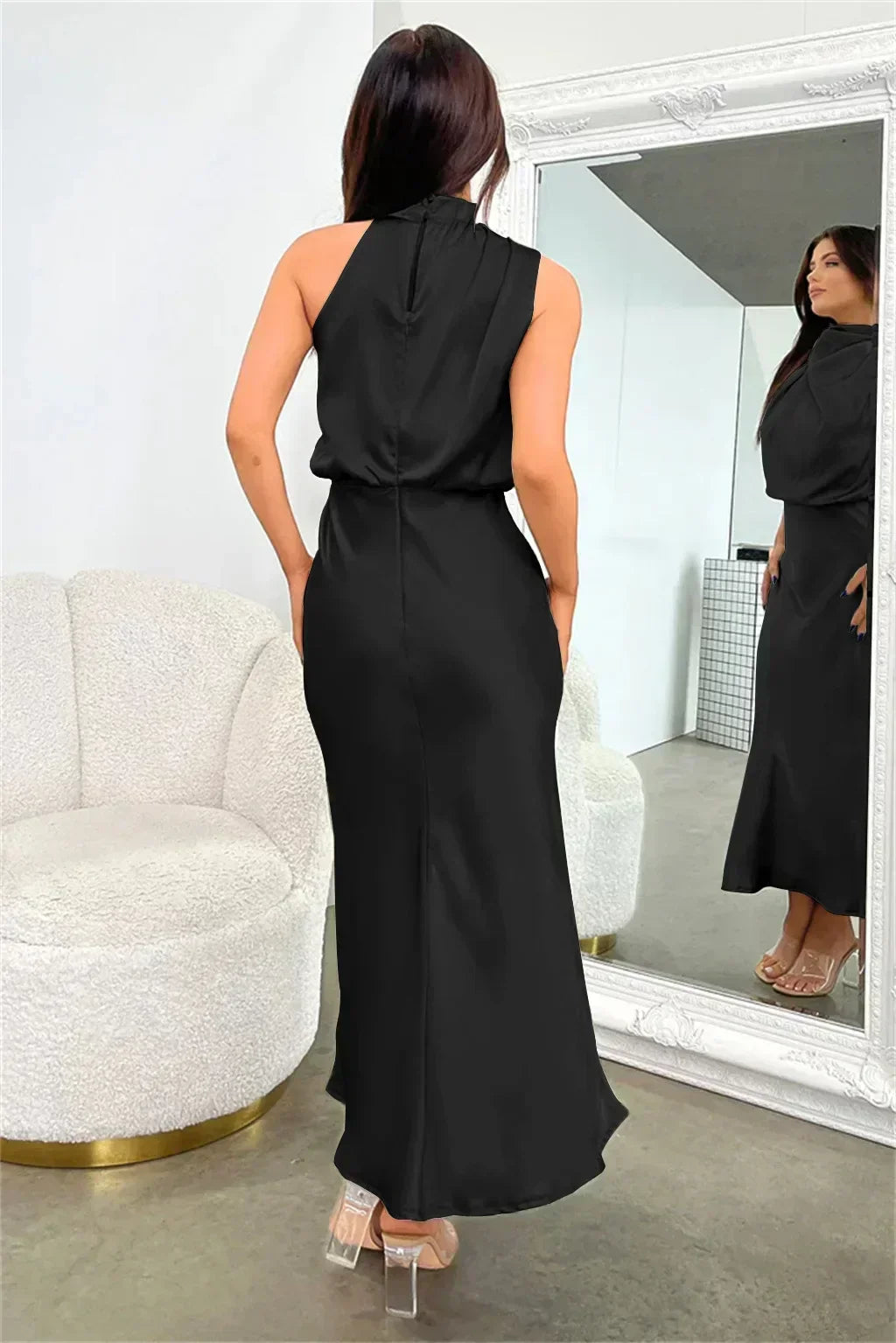 Graceful women's halter evening gown, open back, flowing silhouette, floor-length for special events.