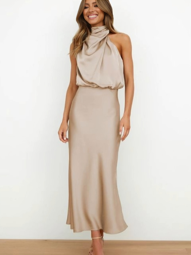 Gala-ready women's formal halter dress, elegant open back, flowing floor-length design for special events.
