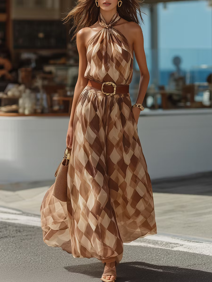 Elegant women's halter maxi dress featuring a chic geometric print and belted waist, perfect for summer vacation.