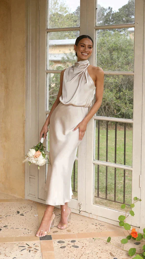 Elegant women's halter midi dress, perfect for parties & summer occasions. Flattering flowy design.