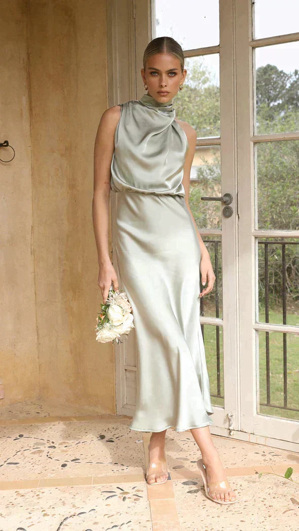 Flowy women's summer midi halter dress. Elegant and flattering for any occasion or party.